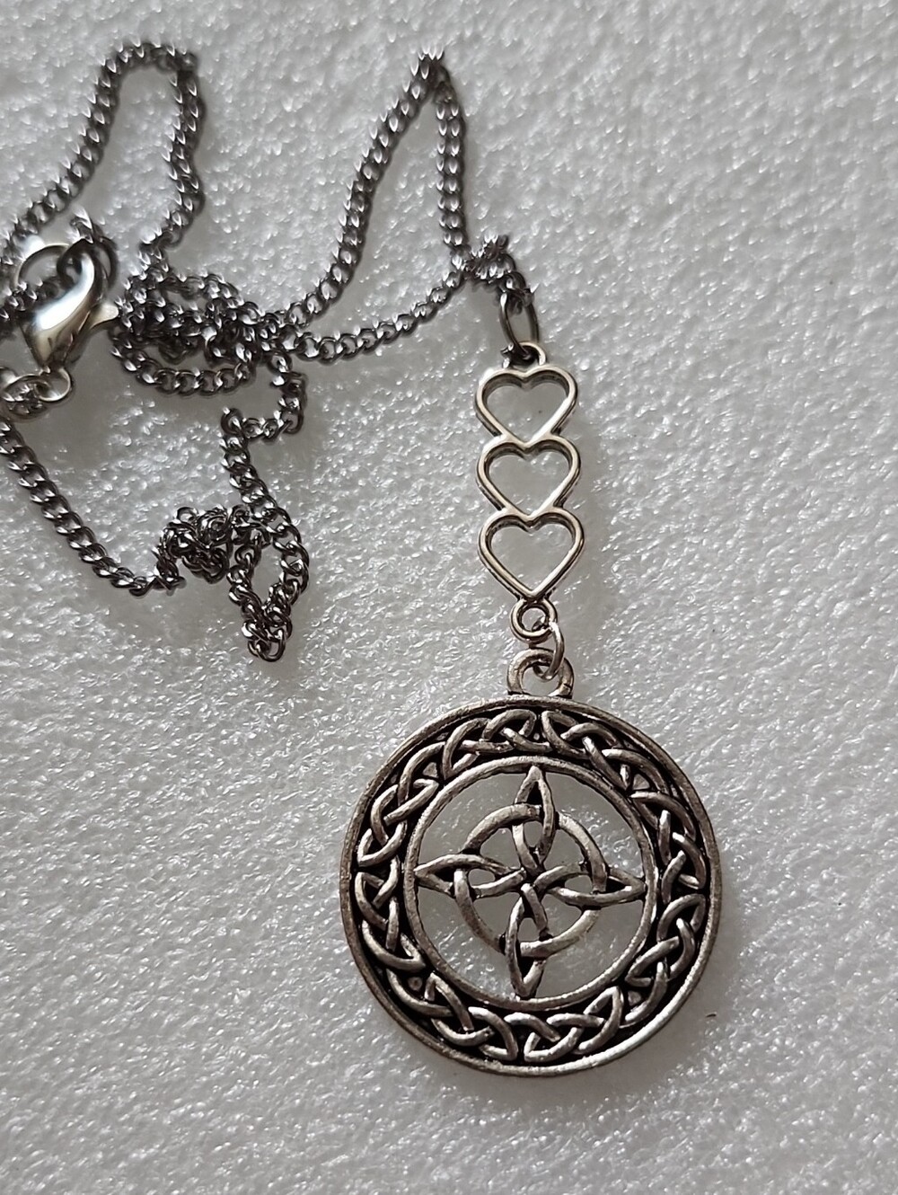 Hand Crafted Silver Celtic Knot Pendant with Triple Heart Links